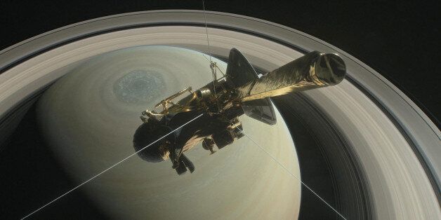 The spacecraft Cassini is pictured above Saturn's northern hemisphere prior to making one of its Grand Finale dives in this NASA handout illustration obtained by Reuters August 29, 2017. NASA/Handout via REUTERS ATTENTION EDITORS - THIS IMAGE WAS PROVIDED BY A THIRD PARTY.