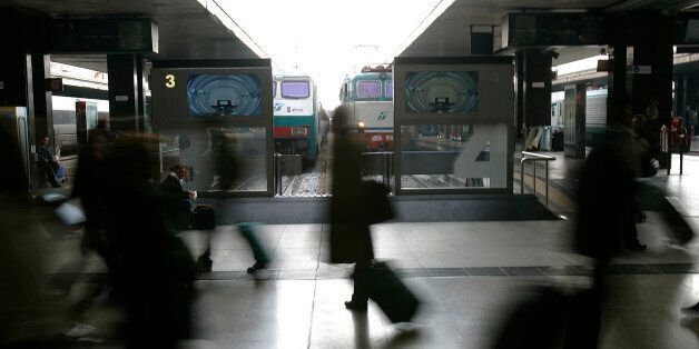 Passengers walk at the Termini railway station in Rome November 30, 2007. Planes, trains, buses and ferries came to a halt in Italy on Friday as workers across virtually all transport services staged a nationwide strike. REUTERS/Max Rossi (ITALY)