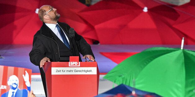 MUNICH, GERMANY - SEPTEMBER 14: German Social Democrat (SPD) and chancellor candidate Martin Schulz continues to speak despite it starting to rain during an election campaign stop on September 14, 2017 in Munich, Germany. Germany will hold federal elections on September 24 and Schulz is currently trailing Chancellor and Christian Democrat (CDU) Angela Merkel, who is seeking a fourth term, by double digits. (Photo by Joerg Koch/Getty Images)