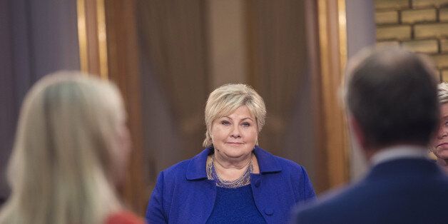 Erna Solberg, Norway's prime minister, center, attends a televised debate against Jonas Gahr Store,Â leader of Norway's Labor Party, not pictured, following a parliamentary election in Oslo, Norway, early on Tuesday, Sept. 12, 2017. SolbergÂ became Norway's first Conservative Party leader in over three decadesÂ to be re-elected as voters embraced her promise of tax cuts after a first term shaped by record government spending. Photographer: Kyrre Lien/Bloomberg via Getty Images