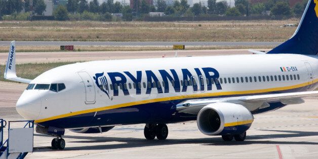 'Valencia, Spain - June 24, 2010: A Ryanair aircraft taxis to the gate at the Valencia airport. Ryanair is Europe\\\'s largest low-cost carrier, the 2nd-largest airline in Europe in terms of passenger numbers and the largest in the world in terms of international passenger numbers.'