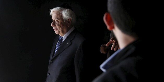 Greek President Prokopis Pavlopoulos leaves after a ceremony in the Hall of Remembrance at Yad Vashem Holocaust Memorial in Jerusalem March 30, 2016. REUTERS/Ronen Zvulun