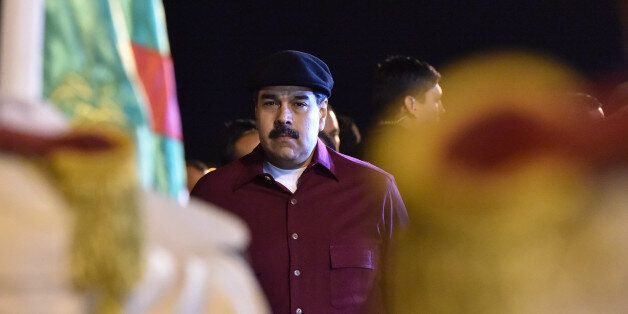 Venezuelan President Nicolas Maduro arrives at the Houari Boumedien Airport in Algiers for a two-day visit on September 10, 2017.Maduro is visiting fellow oil exporter Algeria days after announcing his country would sell crude in non-dollar currencies in a bid to resist US sanctions. / AFP PHOTO / RYAD KRAMDI / RYAD KRAMDI (Photo credit should read RYAD KRAMDI/AFP/Getty Images)