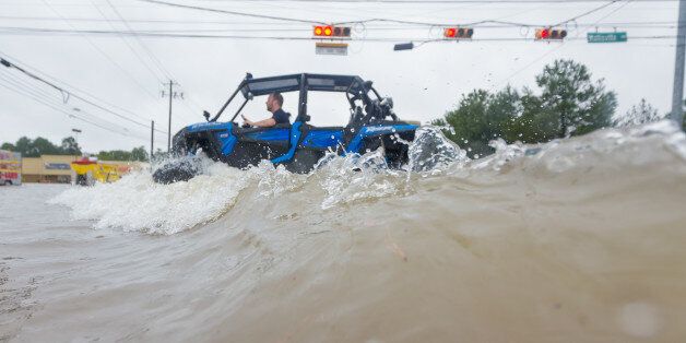 HOUSTON, TX - AUGUST 28: Volunteers with RZR crossing the intersection at Wallisville and Uvalde is underwater during Hurricane Harvey, Monday, August 28, 2017. (Photo by Juan DeLeon/Icon Sportswire via Getty Images)