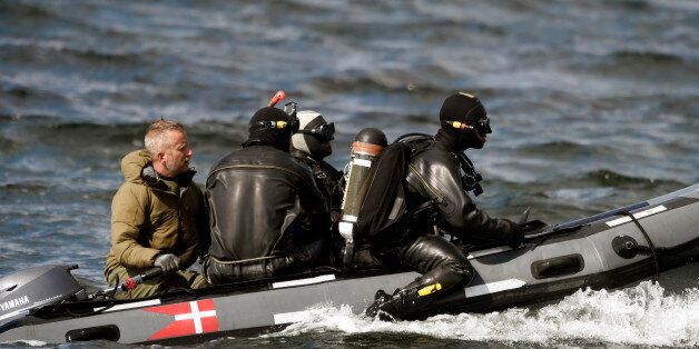 Divers from the Danish Defence Command preparing for a dive in Koge Bugt near Amager in Copenhagen on August 22, 2017 where a woman torso was found yesterday. A Swedish journalist, Kim Wall, went missing after going sailing with the submarine, UC3 Nautilus, on August 10. / AFP PHOTO / Scanpix Denmark AND Scanpix / Liselotte Sabroe / Denmark OUT (Photo credit should read LISELOTTE SABROE/AFP/Getty Images)