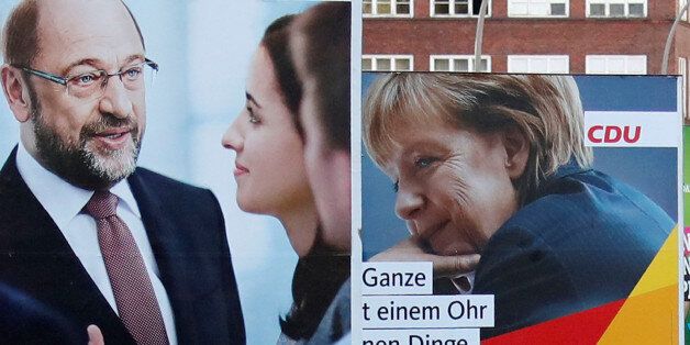 Election campaign posters for the upcoming general elections of the Christian Democratic Union party (CDU) with a headshot of German Chancellor Angela Merkel and of Germany's Social Democratic Party SPD candidate for chancellor Martin Schulz are pictured in Berlin, Germany, August 28, 2017. REUTERS/Fabrizio Bensch