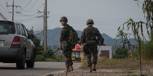 South Korean soldiers walk to a checkpoint at the Demilitarized zone (DMZ) separating North and South Korea, on Ganghwa island on September 4, 2017.North Korea could be preparing another missile launch, Seoul said September 4 as it strengthened its defences following Pyongyang's biggest-ever nuclear test and declaration it had a hydrogen bomb. / AFP PHOTO / Ed JONES (Photo credit should read ED JONES/AFP/Getty Images)