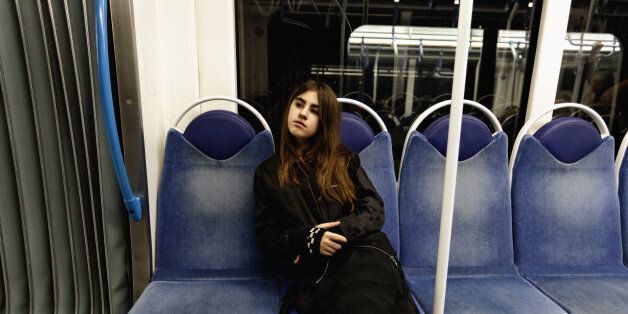 Young girl commuting on subway. 400 ISO.
