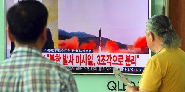 People watch a television news screen showing file footage of a North Korean missile launch, at a railway station in Seoul on August 29, 2017.Nuclear-armed North Korea fired a ballistic missile over Japan and into the Pacific Ocean on August 29 in a major escalation by Pyongyang amid tensions over its weapons ambitions. / AFP PHOTO / JUNG Yeon-Je (Photo credit should read JUNG YEON-JE/AFP/Getty Images)