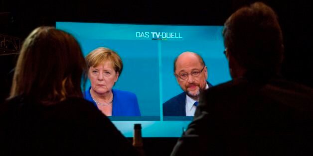 Journalists watch a televised debate between German Chancellor and leader of the conservative Christian Democratic Union (CDU) party Angela Merkel and Martin Schulz, leader of Germany's social democratic SPD party and candidate for Chancellor at a television studio in Berlin on September 3, 2017.Angela Merkel, Germany's cool and collected chancellor, is going head-to-head with her fiery challenger Martin Schulz in their only television debate before this month's general elections, in a crucial match that could sway millions of voters. / AFP PHOTO / John MACDOUGALL (Photo credit should read JOHN MACDOUGALL/AFP/Getty Images)