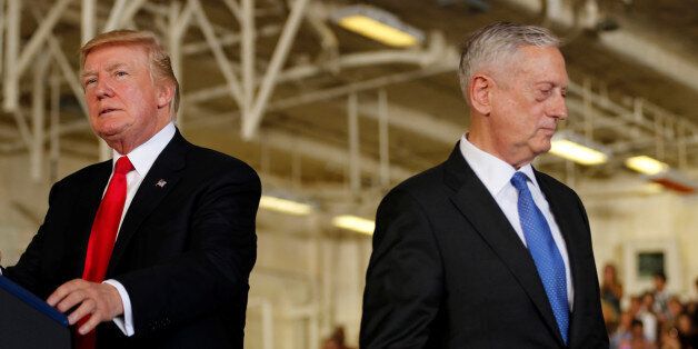 U.S. President Donald Trump (L) is introduced by Defense Secretary James Mattis (R) during the commissioning ceremony of the aircraft carrier USS Gerald R. Ford at Naval Station Norfolk in Norfolk, Virginia, U.S. July 22, 2017. REUTERS/Jonathan Ernst