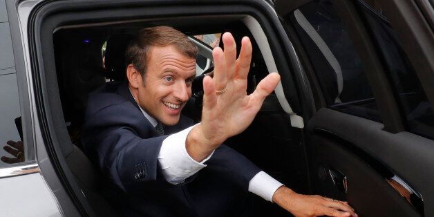 French President Emmanuel Macron waves from his car after visiting a school at the start of the new school year in Forbach, eastern France on September 4, 2017. / AFP PHOTO / POOL / PHILIPPE WOJAZER (Photo credit should read PHILIPPE WOJAZER/AFP/Getty Images)