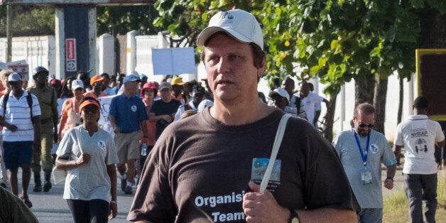 A picture taken on January 14, 2017, shows South African conservationist Wayne Lotter taking part in the Walk for Elephants event endorsed by the Chinese embassy, in Dar es Salaam.Lotter, a leading conservationist who had worked hard to bring down notorious elephant poachers and stop ivory-trafficking, has been shot dead in Tanzania, his PAMS foundation said on August 20, 2017. The motive for the killing of the South African was unknown. / AFP PHOTO / Daniel Hayduk (Photo credit should r