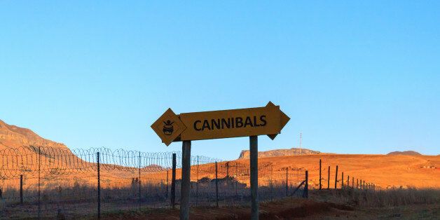 Cannibals road sign on the road to Drakensberg mountains, South Africa.