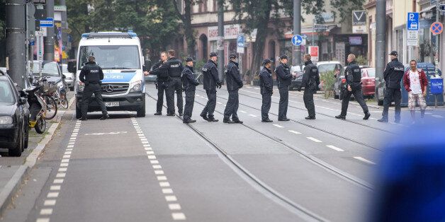 Police officers control if the residents have left their apartments as evacuation measures are under way in Frankfurt am Main, western Germany, on September 3, 2017.More than 60,000 people are set to be evacuated from Frankfurt's Westend district after a British World War II bomb (HC 4000 air mine) was discovered on a construction site close to the Goethe University compound last Tuesday, August 29, 2017. The operation to defuse the bomb is expected to begin at 12.00 am and to take approximately