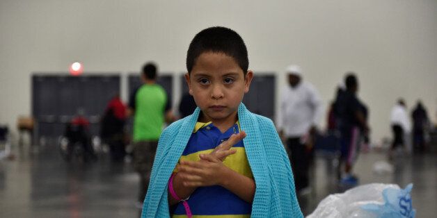 Evacuee Pete Quintana Jr. is wrapped in a blanket at the George R. Brown Convention Center after Hurricane Harvey inundated the Texas Gulf coast with rain causing widespread flooding, in Houston, Texas, U.S. August 28, 2017. Picture taken August 28, 2017. REUTERS/Nick Oxford