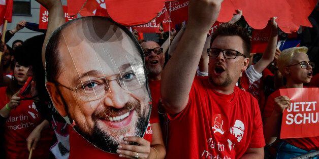 Supporters of Martin Schulz, leader of Germany's social democratic SPD party and chancellor candidate shout slogans after Schulz arrived for a televised debate at a television studio in Berlin on September 3, 2017.Angela Merkel, Germany's cool and collected chancellor, is going head-to-head with her fiery challenger Martin Schulz in their only television debate before this month's general elections, in a crucial match that could sway millions of voters. / AFP PHOTO / John MACDOUGALL (Photo credit should read JOHN MACDOUGALL/AFP/Getty Images)