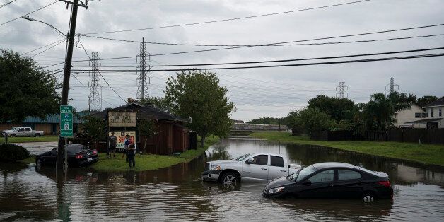 HOUSTON, TX - AUGUST 27: Vehicles are seen abandoned in flood water along Beamer Road in Houston, TX on Sunday, Aug 27, 2017. Rising water from Hurricane Harvey pushed thousands of people to rooftops or higher ground Sunday in Houston. (Photo by Jabin Botsford/The Washington Post via Getty Images)