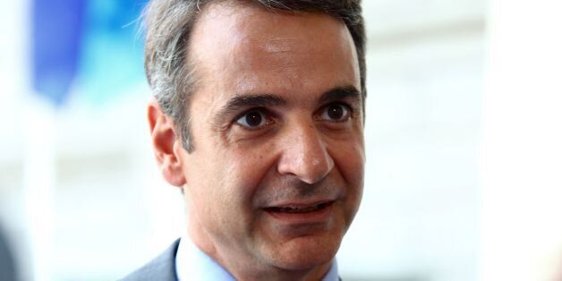 President of the Greek liberal-conservative New Democracy party Kyriakos Mitsotakis speaks to the press upon his arrival at the European People's Party headquarters (EPP) in Brussels for a EPP meeting on the sidelines of the EU leaders summit, in June 22, 2017. / AFP PHOTO / Aurore BELOT (Photo credit should read AURORE BELOT/AFP/Getty Images)