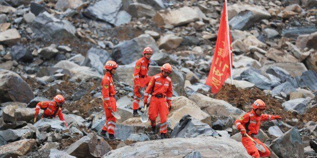 BIJIE, CHINA - AUGUST 29: Rescuers search for survivors after a landslide at Nayong County on August 29, 2017 in Bijie, Guizhou Province of China. A landslide occurred at around 10:40 am Monday in Nayong county of Guizhou, killing 15 people. (Photo by VCG/VCG via Getty Images)
