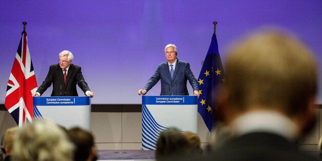David Davis, U.K. exiting the European Union (EU) secretary, left, speaks as Michel Barnier, chief negotiator for the European Union (EU), looks on during a news conference following the third round of Brexit talks in Brussels, Belgium, on Thursday, Aug. 31, 2017. Barnier said Brexit talks are far from making the progress thats needed to move on to trade talks, as three days of negotiations produced few results. Photographer: Dario Pignatelli/Bloomberg via Getty Images