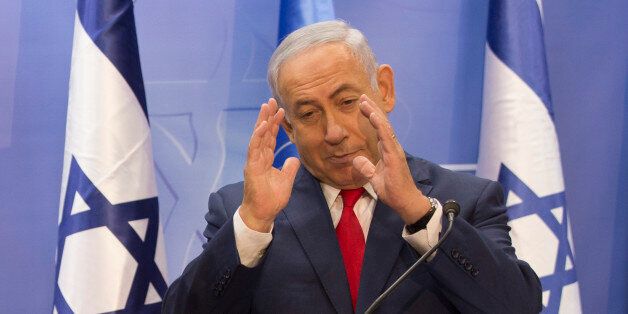 Israeli Prime Minister Benjamin Netanyahu gestures during a press conference with the UN secretary general at his office in Jerusalem on August 28, 2017.UN Secretary General Antonio Guterres meets Israeli officials as he begins a three-day visit to the Jewish state and the Palestinian territories. / AFP PHOTO / POOL / Heidi Levine (Photo credit should read HEIDI LEVINE/AFP/Getty Images)