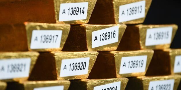 Gold bars are presented at the German Central Bank in Frankfurt am Main, central Germany on August 23, 2017.The Bundesbank, the German central bank, announced that it has completed the repatriation of all its gold reserves still stocked in Paris and part of those in the United States. / AFP PHOTO / dpa / Arne Dedert / Germany OUT (Photo credit should read ARNE DEDERT/AFP/Getty Images)