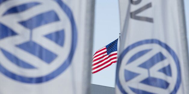 FILE PHOTO - An American flag flies next to a Volkswagen car dealership in San Diego, California, U.S. September 23, 2015. REUTERS/Mike Blake/File Photo