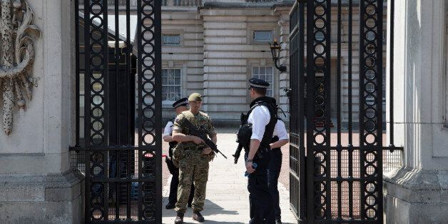 Following recent terror attacks, security is heightened with more armed police on the streets and the Army adding a military presence, policing important buildings, as here at Buckingham Palace in London, England, United Kingdom. (photo by Mike Kemp/In Pictures via Getty Images)