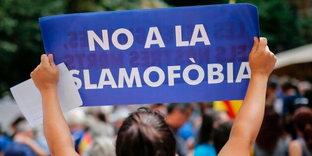 A woman holds a placard reading in Catalan 'No to Islamophobia' prior to a march against terrorism which slogan will be #NoTincPor (I'm Not Afraid) in Barcelona on August 26, 2017, following the Barcelona and Cambrils attacks killing 15 people and injuring over 100.Tens of thousands of Spaniards and foreigners are to stage a defiant march against terror through Barcelona on August 26 following last week's deadly vehicle rampages.The Mediterranean city is in mourning after a van ploughed into cro
