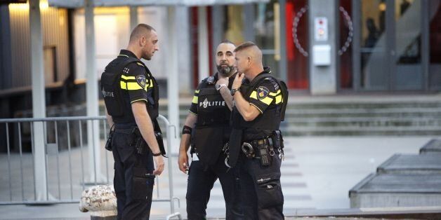Police stand during the evacuation the Maassilo concert venue after a concert by Californian ban Allah-Las was canceled in relation to a terror attack threat, according to police and the venue, on August 23, 2017, in Rotterdam. / AFP PHOTO / ANP / Arie Kievit / Netherlands OUT (Photo credit should read ARIE KIEVIT/AFP/Getty Images)
