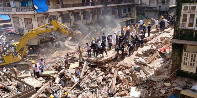 Firefighters and rescue workers search for survivors at the site of a collapsed building in Mumbai, India, August 31, 2017. REUTERS/Shailesh Andrade TPX IMAGES OF THE DAY