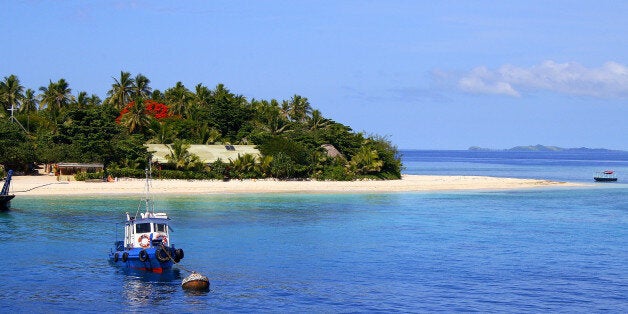 Ship anchored and Tropical paradise island: Dreamlike Sand deserted turquoise beach, Idyllic Yasawas, Fiji Islands