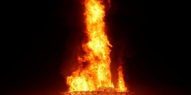 The Temple burns as approximately 70,000 people from all over the world gathered for the annual Burning Man arts and music festival in the Black Rock Desert of Nevada, U.S. September 3, 2017. REUTERS/Jim Urquhart FOR USE WITH BURNING MAN RELATED REPORTING ONLY. FOR EDITORIAL USE ONLY. NOT FOR SALE FOR MARKETING OR ADVERTISING CAMPAIGNS. NO THIRD PARTY SALES. NOT FOR USE BY REUTERS THIRD PARTY DISTRIBUTORS.