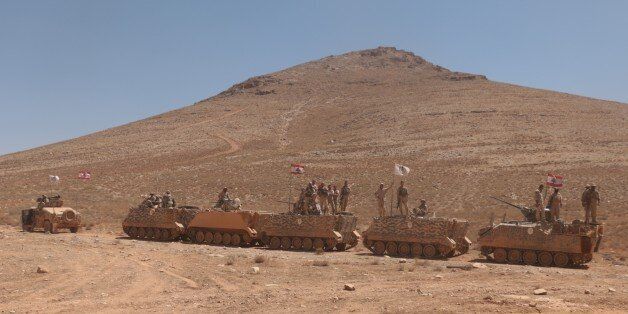 BAALBEK, LEBANON - AUGUST 28: Lebanese soldiers stand guard at Lebanon-Syria border with armoured vehicles after Lebanese army ended the 'Dawn of the Mountains' operation against Daesh on 19th of August, in Baalbek, Lebanon on August 28, 2017. Lebanese army organised a tour to inform the press members, composed of indigenous and foreign press members, at the border. (Photo by Muhammed Ali Akman/Anadolu Agency/Getty Images)