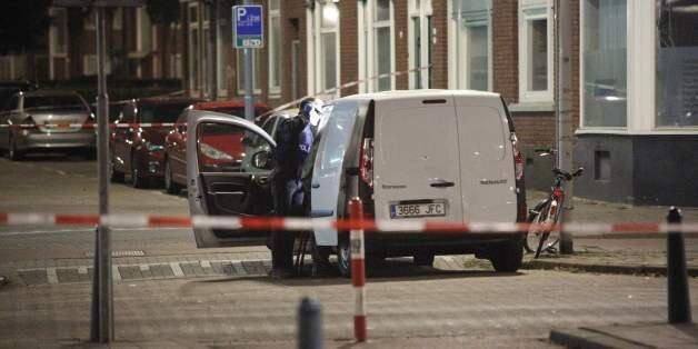 Police investigates a van with Spanish number plate packed with gas canisters in the vicinity of the concert venue Maassilo, after a concert was cancelled because of a terror threat, in Rotterdam, on August 23, 2017. A rock concert in Rotterdam was cancelled on August 23 due to a terror threat involving a Spanish van found with gas bottles inside, the local mayor said. Earlier the Maassilo venue announced that 'due to a terrorist threat, the Allah-Las concert will not take place this evening, on police orders'. Rotterdam police confirmed the decision was taken due to a 'possible terrorist threat' and that the van's driver had been arrested. / AFP PHOTO / ANP / Arie Kievit / Netherlands OUT (Photo credit should read ARIE KIEVIT/AFP/Getty Images)