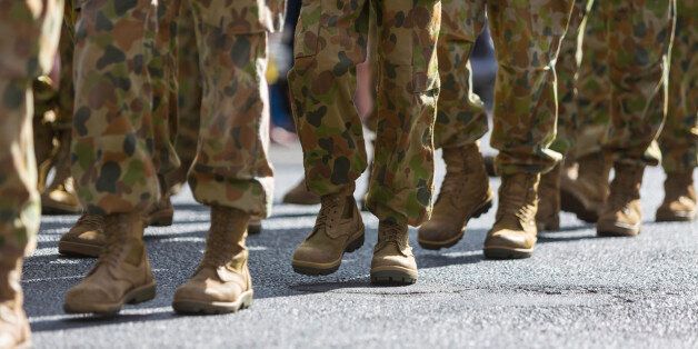 Feet of soldiers marching at an ANZAC Day parade on the streets of a regional country town