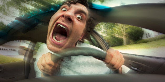 Silly man gets into car crash and makes ridiculous face