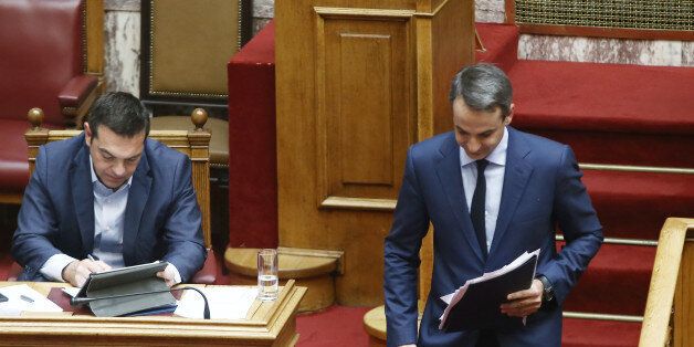 Prime Minister Alexis Tsipras (L) and Kyriakos Mitsotakis, New Democracy main opposition leader during a discussion on the economy at Parliament, in Athens on July 3,2017 (Photo by Panayotis Tzamaros/NurPhoto via Getty Images)