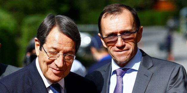 Cypriot President Nicos Anastasiades and United Nations Special Advisor on Cyprus Espen Barth Eide arrive for peace talks on divided Cyprus under the supervision of the United Nations in the alpine resort of Crans-Montana, Switzerland June 28, 2017. REUTERS/Denis Balibouse