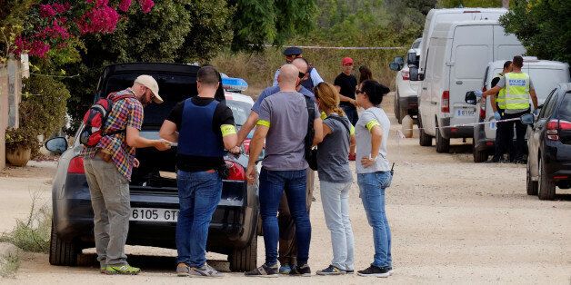 Police in plain clothes gather at the site where a house, which Barcelona attackers used to prepare the attacks, collapsed on Wednesday in Alcanar near Taragona, Spain August 20, 2017. REUTERS/Heino Kalis