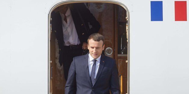 French President Emmanuel Macron disembarks his plane as he arrives to attend the G20 summit in Hamburg, northern Germany, on July 7, 2017.Leaders of the world's top economies gather from July 7 to 8, 2017 in Germany for likely the stormiest G20 summit in years, with disagreements ranging from wars to climate change and global trade. / AFP PHOTO / Georg Wendt (Photo credit should read GEORG WENDT/AFP/Getty Images)