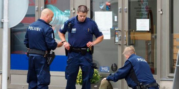 A photo taken from the Instagram account of Kirsi Kanerva on August 18, 2017 shows officials standing in a street next to a person lying on the ground in the Finnish city of Turku where several people were stabbed. Several people were stabbed in the southwestern Finnish city of Turku, police said after shooting and arresting a suspect. Public television station Yle reported that central Turku was on lockdown, with witnesses saying they had seen bodies lying on the ground in a busy area of the town. Businesses were shut. / AFP PHOTO / KIRSI KANERVA (Photo credit should read KIRSI KANERVA/AFP/Getty Images)