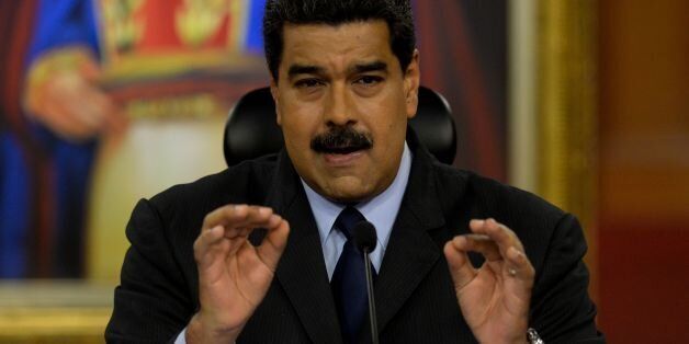Venezuelan President Nicolas Maduro speaks during a press conference with international media correspondents at the Miraflores Presidential Palace in Caracas on January 18, 2017. Venezuelan President Nicolas Maduro on Monday denounced a 'hate campaign' aimed at Donald Trump, saying the US president-elect's administration would not be 'worse' than Barack Obama's. The socialist president said he will wait until Trump takes over the White House on Friday before making judgments on the incoming US president's foreign policy. / AFP / FEDERICO PARRA (Photo credit should read FEDERICO PARRA/AFP/Getty Images)