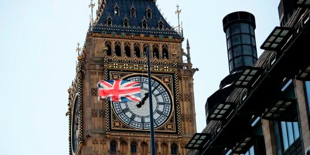 A Union flag flies at half-mast from the roof of a building, in front of a face of the Great Clock of the Palace of Westminster's Elizabeth Tower, more commonly referred to as Big Ben, in London on August 18, 2017, following the August 17 attacks in Barcelona and Cambrils in Spain. Spanish police on Friday hunted for the driver who rammed a van into pedestrians on an avenue crowded with tourists in Barcelona, leaving 13 people dead and more than 100 injured, just hours before a second assault i