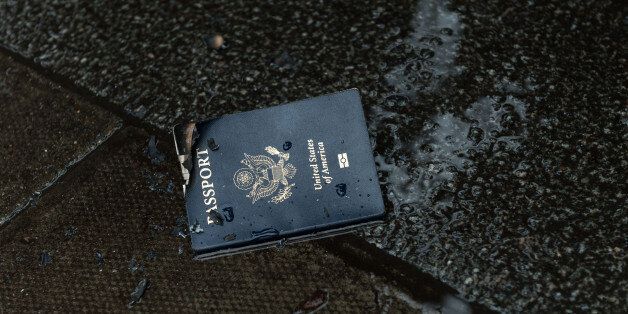 LONDON, UNITED KINGDOM - FEBRUARY 04: American passport lays on a wet pavement after it was burnt at the demonstration outside the US Embassy on February 04, 2017 in London, England.Thousands of people take part in a protest against Donald Trump's executive order temporarily banning immigrants and refugees from seven majority Muslim countries to travel to the US. The participants gather outside the US Embassy in Grosvenor Square and march through central London to Downing Street in opposition to Donald Trump's policies and against the British government supporting the President of the United States . PHOTOGRAPH BY Wiktor Szymanowicz / Barcroft ImagesLondon-T:+44 207 033 1031 E:hello@barcroftmedia.com -New York-T:+1 212 796 2458 E:hello@barcroftusa.com -New Delhi-T:+91 11 4053 2429 E:hello@barcroftindia.com www.barcroftimages.com (Photo credit should read W Szymanowicz / Barcroft Images / Barcroft Media via Getty Images)