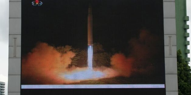 Coverage of an ICBM missile test is displayed on a screen in a public square in Pyongyang on July 29, 2017.Kim Jong-Un boasted of North Korea's ability to strike any target in the US after a second ICBM test that weapons experts said on July 29 could even bring New York into range - in a potent challenge to President Donald Trump. / AFP PHOTO / Kim Won-Jin (Photo credit should read KIM WON-JIN/AFP/Getty Images)