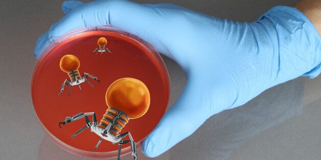 Conceptual illustration of a gloved hand holding a petri dish with nanorobots emerging from the dish. The use of nanotechnology in medicine, particularly as a tool in combating cancer, is an emerging technology.