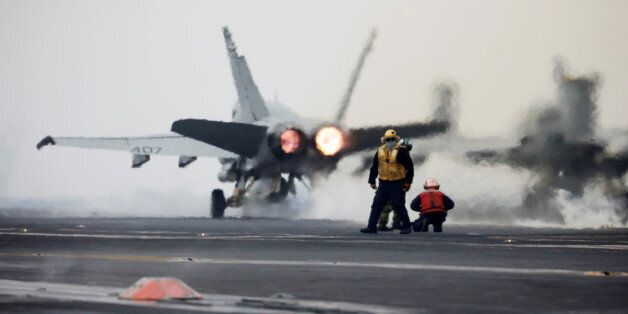 A U.S. Navy F18 fighter jet takes off from the deck of U.S. aircraft carrier USS Carl Vinson during an annual joint military exercise called
