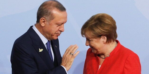 HAMBURG, GERMANY - JULY 7, 2017: Germany's Chancellor Angela Merkel (R) greets Turkey's President Recep Tayyip Erdogan ahead of a G20 summit. Mikhail Metzel/TASS (Photo by Mikhail Metzel\TASS via Getty Images)